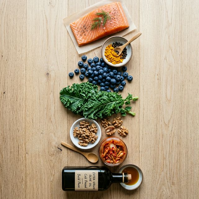 Week 2 anti-inflammatory meal plan BUILD phase: wild salmon, turmeric, blueberries, kale, walnuts, kimchi, and olive oil — the foods with strongest clinical evidence